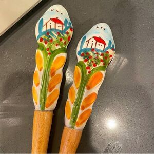Salad servers with village scene